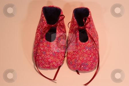 To use this stock image in your creative project, please select the size you need over to the right and click the "Add to Cart" button.
Your downloaded image will come with the Cutcaster watermark removed so don’t worry about the watermark you see on this page. It's a girl stock photo, Hand made baby shoes for a girl. by Mariusz Jurgielewicz