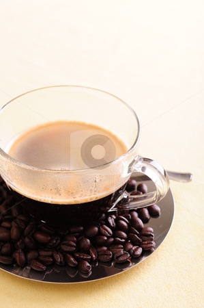 To use this stock image in your creative project, please select the size you need over to the right and click the "Add to Cart" button.
Your downloaded image will come with the Cutcaster watermark removed so don’t worry about the watermark you see on this page. Freshly brewed coffee stock photo, Freshly brewed coffee in a glass cup with coffee beans scattered on the shiny saucer. by Nicolaas Traut