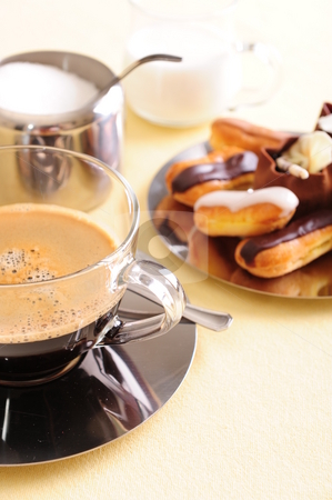 To use this stock image in your creative project, please select the size you need over to the right and click the "Add to Cart" button.
Your downloaded image will come with the Cutcaster watermark removed so don’t worry about the watermark you see on this page. Coffee and Cake stock photo, Freshly brewed coffee with a selection of pastries and cakes. by Nicolaas Traut