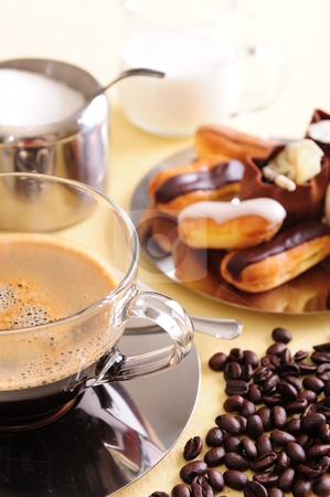 To use this stock image in your creative project, please select the size you need over to the right and click the "Add to Cart" button.
Your downloaded image will come with the Cutcaster watermark removed so don’t worry about the watermark you see on this page. Coffee and Cake stock photo, Freshly brewed coffee with a selection of pastries and cakes. Coffee beans are scattered for extra effect. by Nicolaas Traut