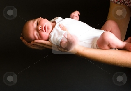 To use this stock image in your creative project, please select the size you need over to the right and click the "Add to Cart" button.
Your downloaded image will come with the Cutcaster watermark removed so don’t worry about the watermark you see on this page. Holding Newborn stock photo, Little 7 days old baby lying securely on mom's arms, against a black background by Mariusz Jurgielewicz