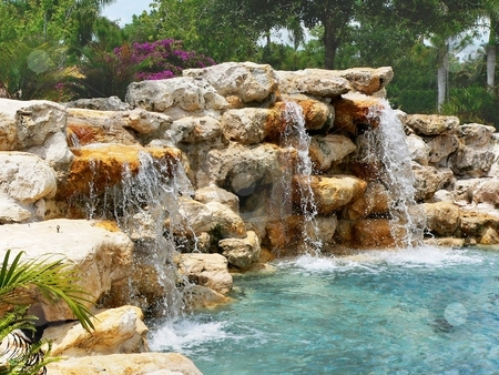 To use this stock image in your creative project, please select the size you need over to the right and click the "Add to Cart" button.
Your downloaded image will come with the Cutcaster watermark removed so don’t worry about the watermark you see on this page. Waterfall stock photo, Stone wall with waterfall and blue pool of water by Perry Correll