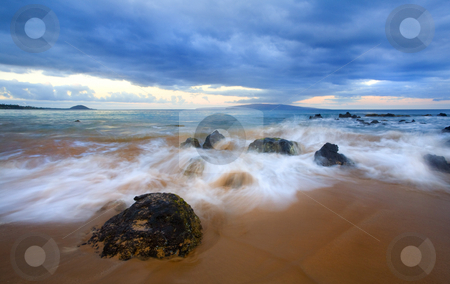 To use this stock image in your creative project, please select the size you need over to the right and click the "Add to Cart" button.
Your downloaded image will come with the Cutcaster watermark removed so don’t worry about the watermark you see on this page. Storm Tides stock photo, The waves of rising tides overcome the lava rock off the coast of Kihei on Maui, Hawauu, Kahaloowe and Molokini are on the horizon under the storm clouds. by Mike Dawson