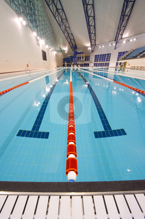 To use this stock image in your creative project, please select the size you need over to the right and click the "Add to Cart" button.
Your downloaded image will come with the Cutcaster watermark removed so don’t worry about the watermark you see on this page. Olympic swimming pool stock photo, Olympic indoor swimming pool at an International sports venue in Doha, Qatar. by Nicolaas Traut