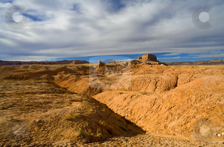 To use this stock image in your creative project, please select the size you need over to the right and click the "Add to Cart" button.
Your downloaded image will come with the Cutcaster watermark removed so don’t worry about the watermark you see on this page. Desert Folds stock photo, The folds and undulations of Gobblin Valley State PArk in Central Utah. by Mike Dawson