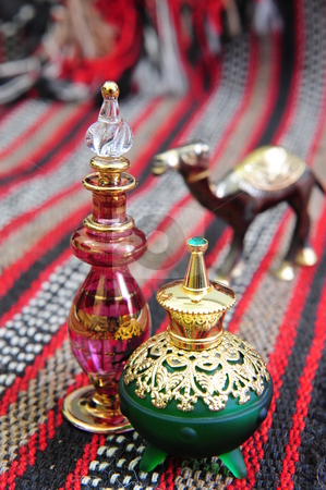 To use this stock image in your creative project, please select the size you need over to the right and click the "Add to Cart" button.
Your downloaded image will come with the Cutcaster watermark removed so don’t worry about the watermark you see on this page. Egyptian perfume bottles stock photo, Egyptian perfume bottles arranged on a hand-woven Omani rug. A small copper replica of a camel is faded in the background. by Nicolaas Traut