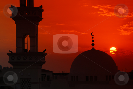 To use this stock image in your creative project, please select the size you need over to the right and click the "Add to Cart" button.
Your downloaded image will come with the Cutcaster watermark removed so don’t worry about the watermark you see on this page. Mosque sunset stock photo, Mosque silhouette etched against a dramatic sunset by Nicolaas Traut