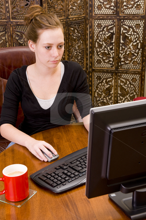 To use this stock image in your creative project, please select the size you need over to the right and click the "Add to Cart" button.
Your downloaded image will come with the Cutcaster watermark removed so don’t worry about the watermark you see on this page. Woman working on PC keyboard and mouse. stock photo, Female executive working on a PC keyboard and/or mouse on a wooden desk. by Nicolaas Traut