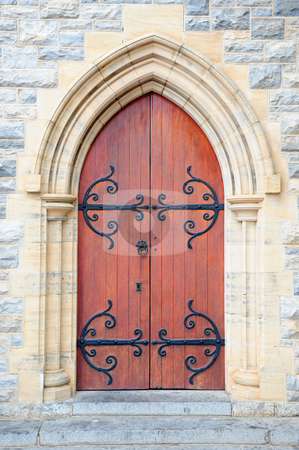 To use this stock image in your creative project, please select the size you need over to the right and click the "Add to Cart" button.
Your downloaded image will come with the Cutcaster watermark removed so don’t worry about the watermark you see on this page. Church door stock photo, Antique church door with black steel decoration in arch on an outside stone wall of a historical church building. by Nicolaas Traut
