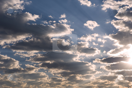 To use this stock image in your creative project, please select the size you need over to the right and click the "Add to Cart" button.
Your downloaded image will come with the Cutcaster watermark removed so don’t worry about the watermark you see on this page. Dramatic clouds in the late afternoon. stock photo, Dramatic late afternoon clouds with the sun on the one edge and rays visible on the blue sky in the background. by Nicolaas Traut