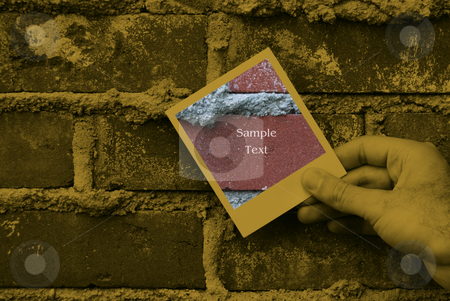 To use this stock image in your creative project, please select the size you need over to the right and click the "Add to Cart" button.
Your downloaded image will come with the Cutcaster watermark removed so don’t worry about the watermark you see on this page. Grunge Brick Work stock photo, Closeup view of someone holding a polaroid against some bricks by Richard Nelson
