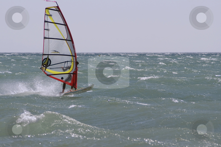 To use this stock image in your creative project, please select the size you need over to the right and click the "Add to Cart" button.
Your downloaded image will come with the Cutcaster watermark removed so don’t worry about the watermark you see on this page. Windboard stock photo, Windboarder at full speed during a windy day in Mediterranean sea. by Serge VILLA