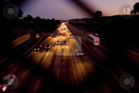 To use this stock image in your creative project, please select the size you need over to the right and click the "Add to Cart" button.
Your downloaded image will come with the Cutcaster watermark removed so don’t worry about the watermark you see on this page. Golden Freeway stock photo, Freeway bathed in gold by car headlights. by Peter Bruenner