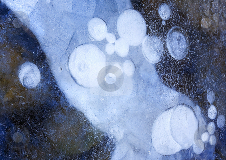 To use this stock image in your creative project, please select the size you need over to the right and click the "Add to Cart" button.
Your downloaded image will come with the Cutcaster watermark removed so don’t worry about the watermark you see on this page. Frozen Orbit stock photo, Bubbles in the Ice along the Tieton River appear frozen in orbit around a large ice flow. by Mike Dawson