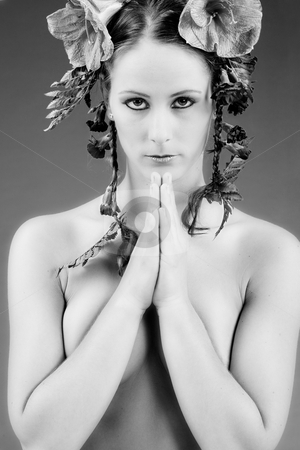To use this stock image in your creative project, please select the size you need over to the right and click the "Add to Cart" button.
Your downloaded image will come with the Cutcaster watermark removed so don’t worry about the watermark you see on this page. Praying flowergirl stock photo, Young woman with big flowers in her hair by Frenk and Danielle Kaufmann