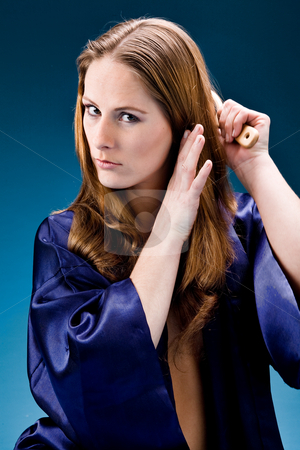To use this stock image in your creative project, please select the size you need over to the right and click the "Add to Cart" button.
Your downloaded image will come with the Cutcaster watermark removed so don’t worry about the watermark you see on this page. Young woman caring of her hair stock photo, Young woman posing in a bathrode in the studio by Frenk and Danielle Kaufmann