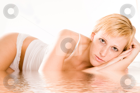To use this stock image in your creative project, please select the size you need over to the right and click the "Add to Cart" button.
Your downloaded image will come with the Cutcaster watermark removed so don’t worry about the watermark you see on this page. Beautiful blond in lingerie looking at nothing stock photo, Studio portrait of a blond short haired girl in lingerie laying on her bed by Frenk and Danielle Kaufmann