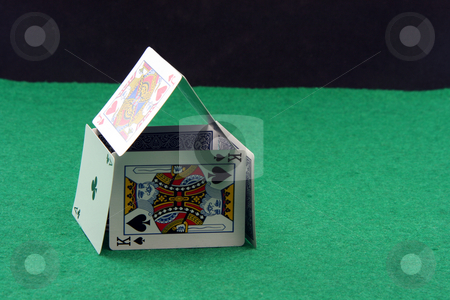 To use this stock image in your creative project, please select the size you need over to the right and click the "Add to Cart" button.
Your downloaded image will come with the Cutcaster watermark removed so don’t worry about the watermark you see on this page. Playing cards house stock photo, House made of playing cards on green felt with copy space black by EVANGELOS THOMAIDIS