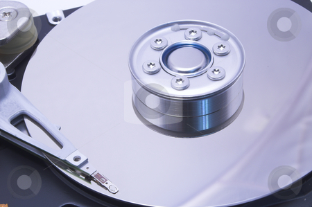 To use this stock image in your creative project, please select the size you need over to the right and click the "Add to Cart" button.
Your downloaded image will come with the Cutcaster watermark removed so don’t worry about the watermark you see on this page. Computer Hard Drive stock photo, An inside view of a computer hard drive. by Robert Byron