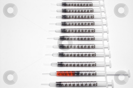 To use this stock image in your creative project, please select the size you need over to the right and click the "Add to Cart" button.
Your downloaded image will come with the Cutcaster watermark removed so don’t worry about the watermark you see on this page. Syringes stock photo, A set of syringes with medication. by Robert Byron