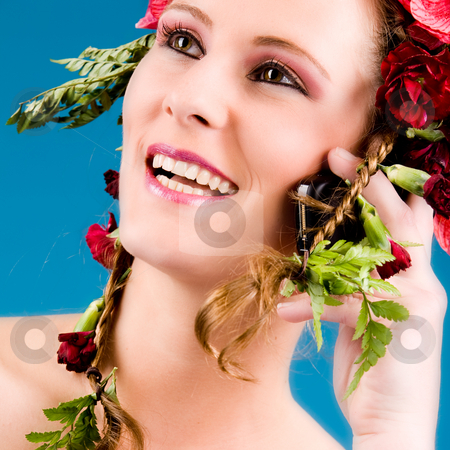 To use this stock image in your creative project, please select the size you need over to the right and click the "Add to Cart" button.
Your downloaded image will come with the Cutcaster watermark removed so don’t worry about the watermark you see on this page. Flowergirl on the phone stock photo, Young woman with big flowers in her hair by Frenk and Danielle Kaufmann