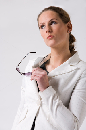 To use this stock image in your creative project, please select the size you need over to the right and click the "Add to Cart" button.
Your downloaded image will come with the Cutcaster watermark removed so don’t worry about the watermark you see on this page. Young woman looking to interesting things stock photo, Young sturdy woman with sunglasses on a white background by Frenk and Danielle Kaufmann