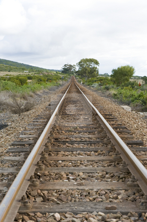 To use this stock image in your creative project, please select the size you need over to the right and click the "Add to Cart" button.
Your downloaded image will come with the Cutcaster watermark removed so don’t worry about the watermark you see on this page. Train track stock photo, A well worn train track running through the countryside. by Nicolaas Traut