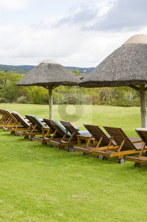 To use this stock image in your creative project, please select the size you need over to the right and click the "Add to Cart" button.
Your downloaded image will come with the Cutcaster watermark removed so don’t worry about the watermark you see on this page. Beautiful garden with swimming pool stock photo, Beautiful lush garden on a farm in the countryside. Some deck-chairs are set on grass near a swimming pool. by Nicolaas Traut