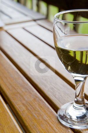 To use this stock image in your creative project, please select the size you need over to the right and click the "Add to Cart" button.
Your downloaded image will come with the Cutcaster watermark removed so don’t worry about the watermark you see on this page. Wine at an outside restaurant stock photo, Glasses of white wine on a wooden table at an outside restaurant on a cloudy day in the countryside. by Nicolaas Traut