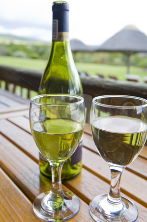To use this stock image in your creative project, please select the size you need over to the right and click the "Add to Cart" button.
Your downloaded image will come with the Cutcaster watermark removed so don’t worry about the watermark you see on this page. Wine at an outside restaurant stock photo, Glasses of white wine on a wooden table at an outside restaurant on a cloudy day in the countryside. by Nicolaas Traut