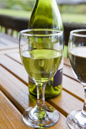 To use this stock image in your creative project, please select the size you need over to the right and click the "Add to Cart" button.
Your downloaded image will come with the Cutcaster watermark removed so don’t worry about the watermark you see on this page. Wine at an outside restaurant stock photo, Glasses of white wine on a wooden table at an outside restaurant on a cloudy day in the countryside. by Nicolaas Traut