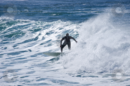 To use this stock image in your creative project, please select the size you need over to the right and click the "Add to Cart" button.
Your downloaded image will come with the Cutcaster watermark removed so don’t worry about the watermark you see on this page. Surfer in the waves stock photo, A surfer in a wave showing perfect style and balance. by Nicolaas Traut