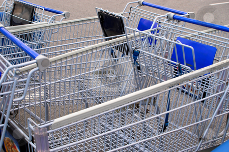 To use this stock image in your creative project, please select the size you need over to the right and click the "Add to Cart" button.
Your downloaded image will come with the Cutcaster watermark removed so don’t worry about the watermark you see on this page. Shopping Carts stock photo, A series of shopping carts at a retail store. by Robert Byron