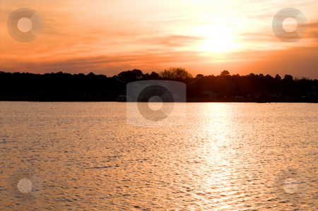 To use this stock image in your creative project, please select the size you need over to the right and click the "Add to Cart" button.
Your downloaded image will come with the Cutcaster watermark removed so don’t worry about the watermark you see on this page. Ocean Sunrise or Sunset stock photo, The sunrise or sunset over a salt water inlet. by Robert Byron