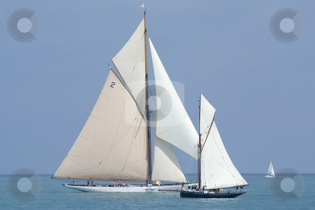 To use this stock image in your creative project, please select the size you need over to the right and click the "Add to Cart" button.
Your downloaded image will come with the Cutcaster watermark removed so don’t worry about the watermark you see on this page. Old sailing boats stock photo, 2 sailing boats before the the regatta. by Serge VILLA