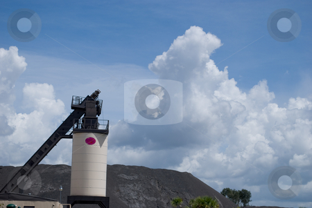 To use this stock image in your creative project, please select the size you need over to the right and click the "Add to Cart" button.
Your downloaded image will come with the Cutcaster watermark removed so don’t worry about the watermark you see on this page. Processing Plant stock photo, Asphalt processing plant with silo and conveyor by Robert Cabrera