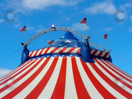 To use this stock image in your creative project, please select the size you need over to the right and click the "Add to Cart" button.
Your downloaded image will come with the Cutcaster watermark removed so don’t worry about the watermark you see on this page. Day out at the circus stock photo, Circus big top tent in field decorated with stars and stripes. by Martin Crowdy