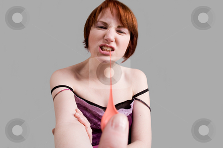 To use this stock image in your creative project, please select the size you need over to the right and click the "Add to Cart" button.
Your downloaded image will come with the Cutcaster watermark removed so don’t worry about the watermark you see on this page. Pull out the bubble gum stock photo, Red haired girl is eating fresh bubblegum by Frenk and Danielle Kaufmann