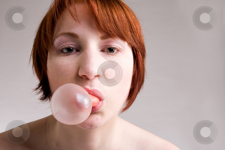 To use this stock image in your creative project, please select the size you need over to the right and click the "Add to Cart" button.
Your downloaded image will come with the Cutcaster watermark removed so don’t worry about the watermark you see on this page. Portrait with bubble gum stock photo, Red haired girl is eating fresh bubblegum by Frenk and Danielle Kaufmann