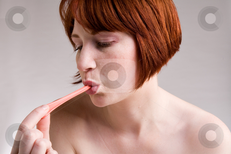 To use this stock image in your creative project, please select the size you need over to the right and click the "Add to Cart" button.
Your downloaded image will come with the Cutcaster watermark removed so don’t worry about the watermark you see on this page. Pull out the bubble gum stock photo, Red haired girl is eating fresh bubblegum by Frenk and Danielle Kaufmann