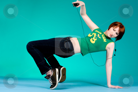 To use this stock image in your creative project, please select the size you need over to the right and click the "Add to Cart" button.
Your downloaded image will come with the Cutcaster watermark removed so don’t worry about the watermark you see on this page. Weird move with mp3 player stock photo, Red haired girl listening to her favourite music by Frenk and Danielle Kaufmann