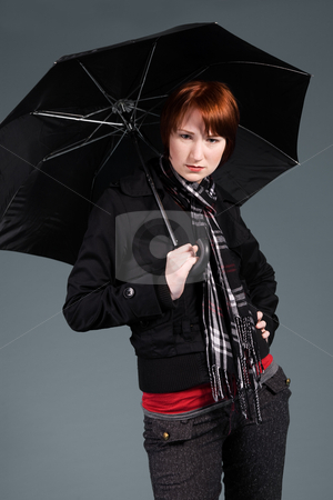 To use this stock image in your creative project, please select the size you need over to the right and click the "Add to Cart" button.
Your downloaded image will come with the Cutcaster watermark removed so don’t worry about the watermark you see on this page. Waiting with my umbrella stock photo, Young red haired girl with her umbrella by Frenk and Danielle Kaufmann