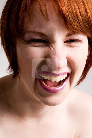 To use this stock image in your creative project, please select the size you need over to the right and click the "Add to Cart" button.
Your downloaded image will come with the Cutcaster watermark removed so don’t worry about the watermark you see on this page. Emotive happy face stock photo, Red haired girl with emotive faces and expressions by Frenk and Danielle Kaufmann