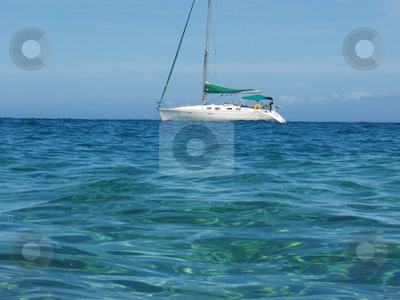 To use this stock image in your creative project, please select the size you need over to the right and click the "Add to Cart" button.
Your downloaded image will come with the Cutcaster watermark removed so don’t worry about the watermark you see on this page. Sailboat from the Ocean stock photo, A sailboat at sea on the ocean by Jeff Clow