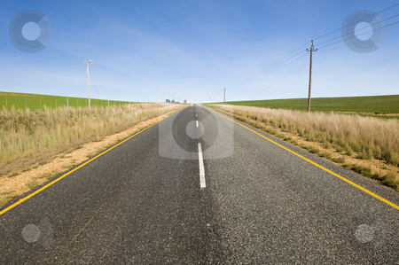To use this stock image in your creative project, please select the size you need over to the right and click the "Add to Cart" button.
Your downloaded image will come with the Cutcaster watermark removed so don’t worry about the watermark you see on this page. Deserted country-road running through green fields stock photo, A deserted country road running through some green fields. by Nicolaas Traut