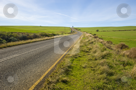 To use this stock image in your creative project, please select the size you need over to the right and click the "Add to Cart" button.
Your downloaded image will come with the Cutcaster watermark removed so don’t worry about the watermark you see on this page. Deserted country-road running through green fields stock photo, A deserted country road running through some green fields. by Nicolaas Traut