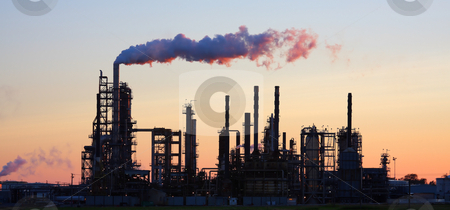 To use this stock image in your creative project, please select the size you need over to the right and click the "Add to Cart" button.
Your downloaded image will come with the Cutcaster watermark removed so don’t worry about the watermark you see on this page. Refinery at Sunset stock photo, Oil refinery at sunset with smoke billowing. by Steve Stedman
