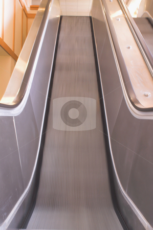 To use this stock image in your creative project, please select the size you need over to the right and click the "Add to Cart" button.
Your downloaded image will come with the Cutcaster watermark removed so don’t worry about the watermark you see on this page. Escalator stock photo, A bank of moving escalators in a building. by Robert Byron