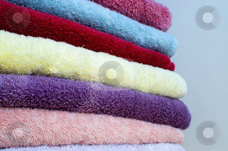 To use this stock image in your creative project, please select the size you need over to the right and click the "Add to Cart" button.
Your downloaded image will come with the Cutcaster watermark removed so don’t worry about the watermark you see on this page. Towels stock photo, A stack of assorted colored trry cloth towels. by Robert Byron