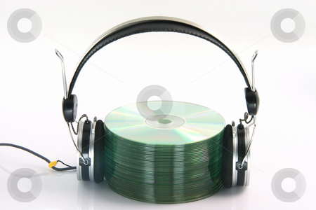 To use this stock image in your creative project, please select the size you need over to the right and click the "Add to Cart" button.
Your downloaded image will come with the Cutcaster watermark removed so don’t worry about the watermark you see on this page. Headphones and cds stock photo, Headphones and pile of compact discs isolated on white background by EVANGELOS THOMAIDIS